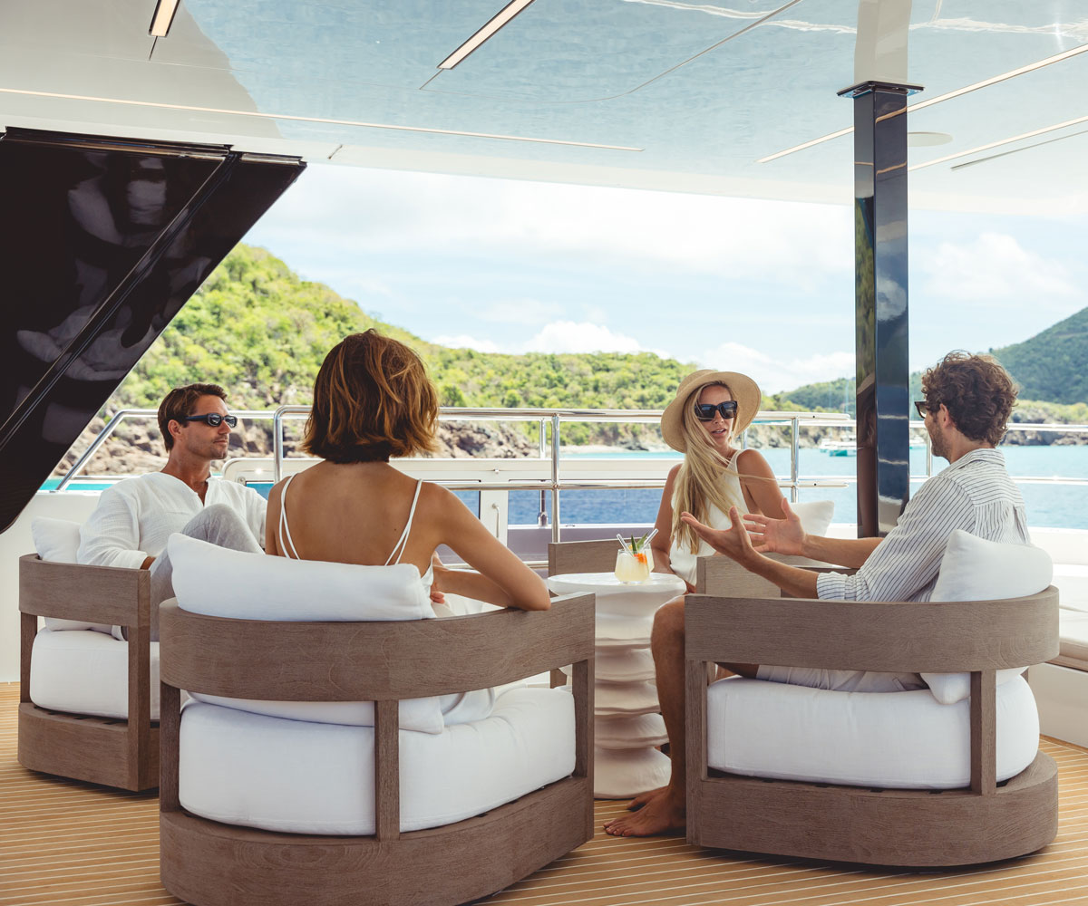 Two couples havong drinks onboard SOL yacht Charter