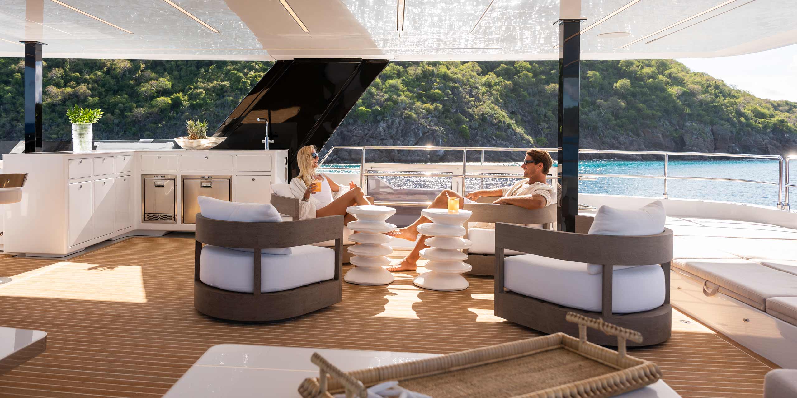 Couple enjoying a charter on the bridge deck of SOL ECO 80